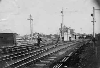 Carnforth East Junction. The building behind East Junction signal box was thought for a long time, to be the original 1857 Furness and Midland Railway, "Station", but recent evidence suggestions that the structure was actually the building which had stood as "Carnforth Station" close to the Furness and Midland Junction between 1868 and 1880. After the opening of the enlarged Carnforth Station on 2nd August 1880, this building became redundant, and was later moved to the site close to East Junction signalbox. Thomas Rathbone collection.