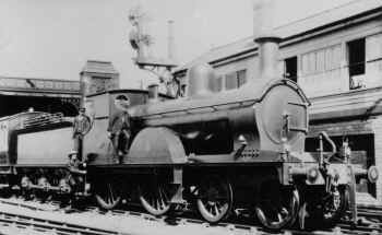 Circa 1905. Furness Railway 4-4-0 No. 127 stands at south end of Carnforth Station with train from Barrow. LGRP 24989.