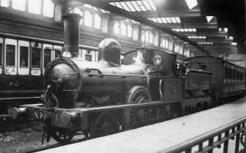 Circa 1890's. Furness Railway No. 1 stands at the south end of the Furness Railway platform at Carnforth with a train from Barrow. LGRP 25951.