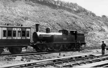 Circa 1905. LNWR 2-4-2 tank No. 2149 waits to leave from the south-facing platforms at Carnforth  with a local train. LGRP 28316.