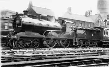 Circa 1920. Furness Railway 4-4-0 No.131 awaits departure from Carnforth for Barrow. LPC 46427