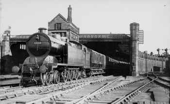 Circa 1925. Furness Railway "Jumbo" 4-6-4 LMS No. 11102 leaves Carnforth with a train for Whitehaven. The train includes through carriages from London Euston. Real-Tidey QQ.