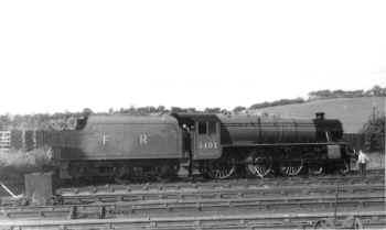 Circa 1970 and Ex LMS "Black 5" 5407 in a Furness Railway livery, at Steamtown, Carnforth. This livery would never have been carried by this locomotive when in "Railway Service". H.C.Casserley