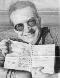 Turning Japanese: Principal tourism officer Jim Trotman with the page out of the visitors book from Carnforth station which is written in Japanese and below, the Japanese comments in close up.