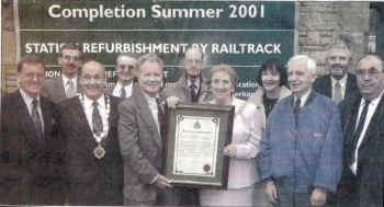 VIPs including the Mayor of Lancaster Coun Brian Ward gather outside the station to mark the start of work on the restoration of the station (06100020/1)